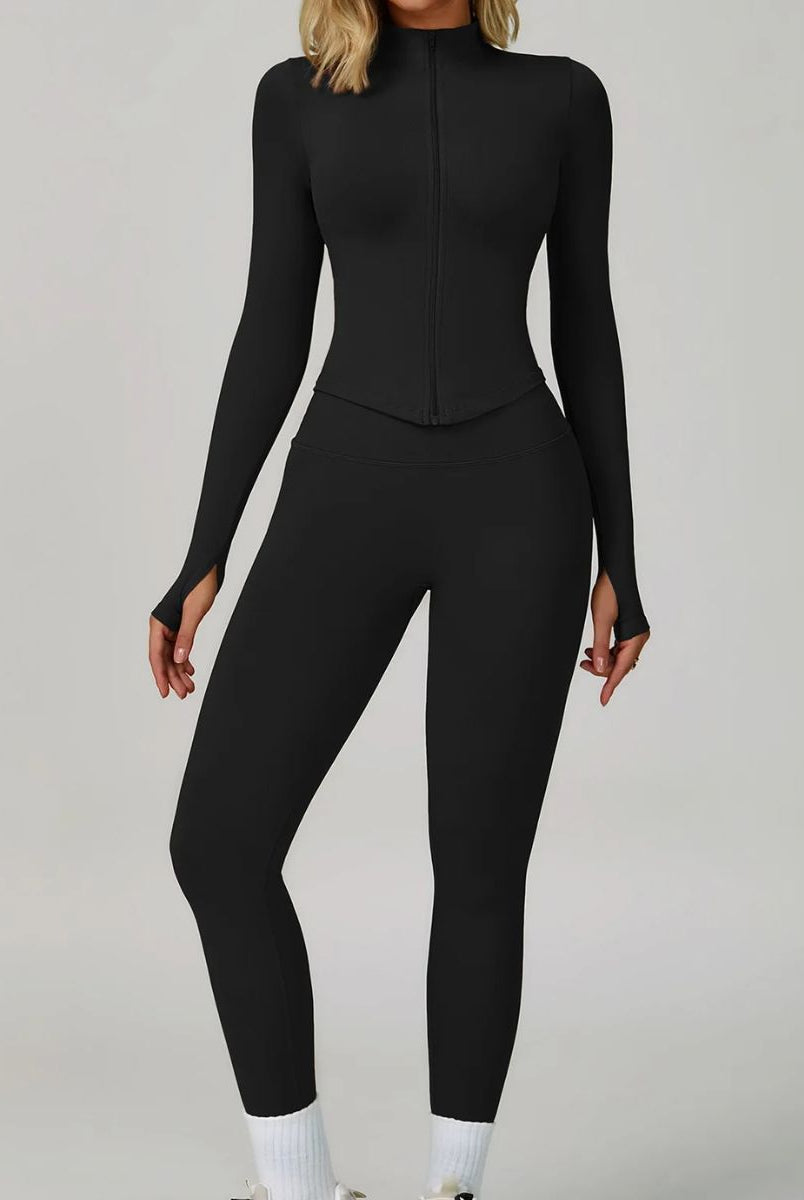 Model wearing the Black ContourFlex Three-Piece Set with top, jacket and leggings in a front-facing standing pose.