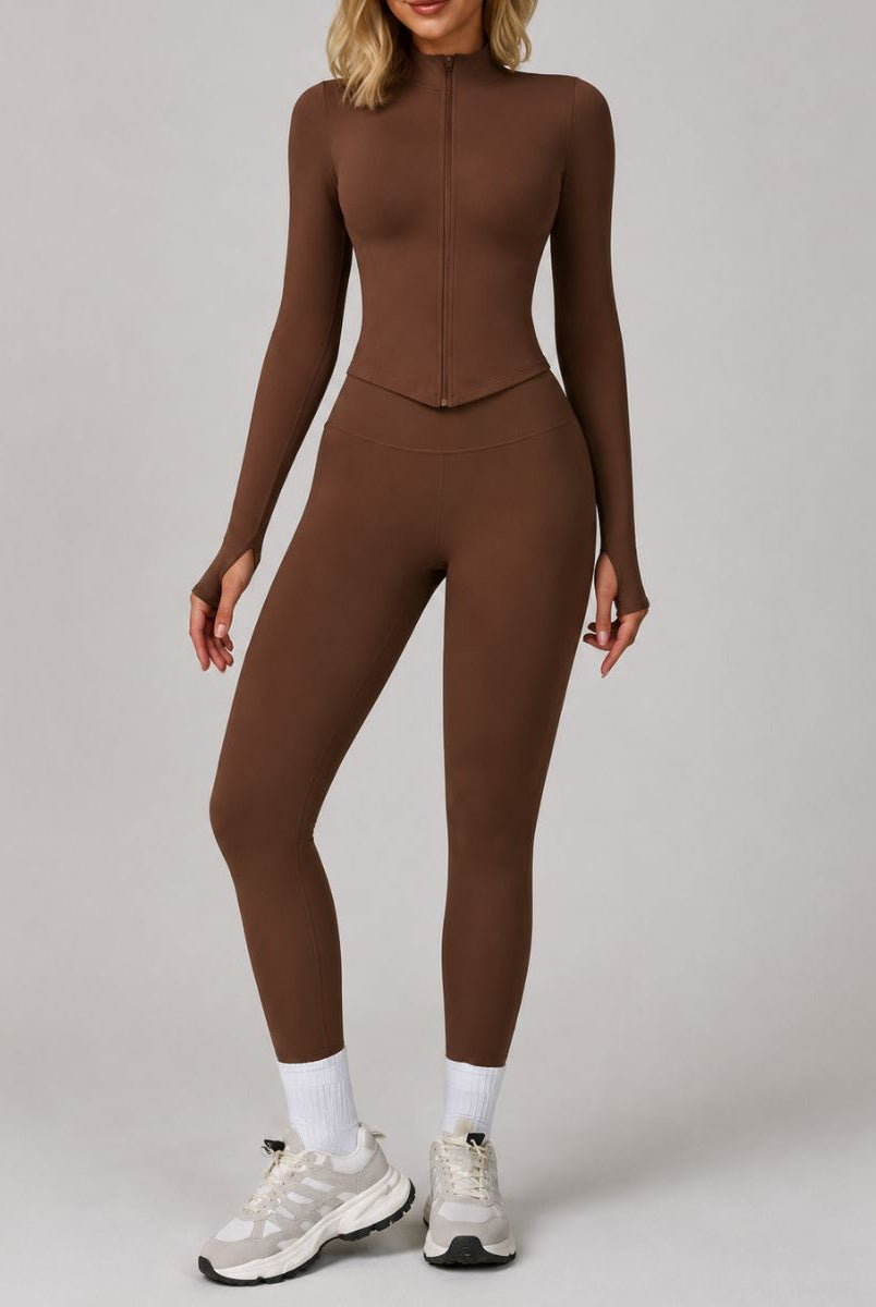 Model wearing the Dark Coffee ContourFlex Three-Piece Set with top, jacket and leggings in a front-facing standing pose.
