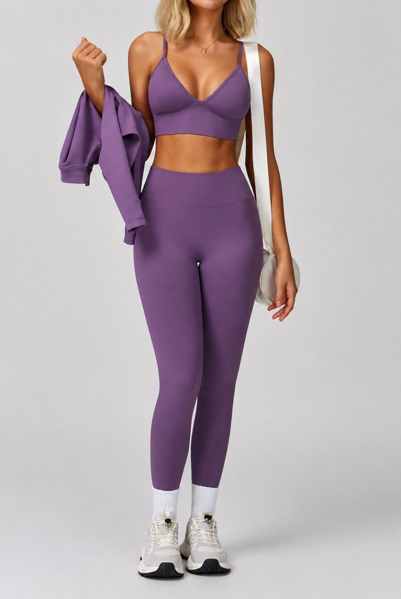 Model wearing the Purple ContourFlex Three-Piece Set in a walking pose, featuring the top and leggings.