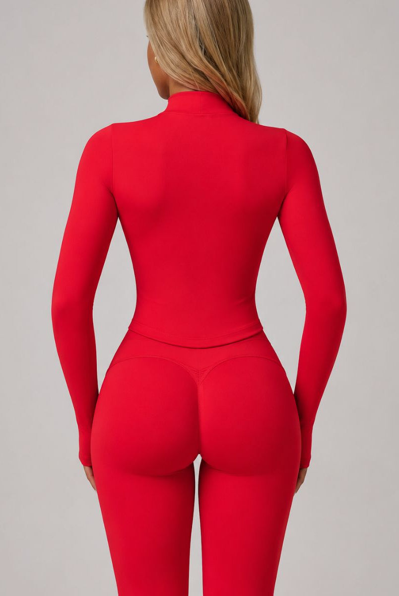 Model wearing the Red ContourFlex Three-Piece Set with top, jacket and leggings in a back-view pose.