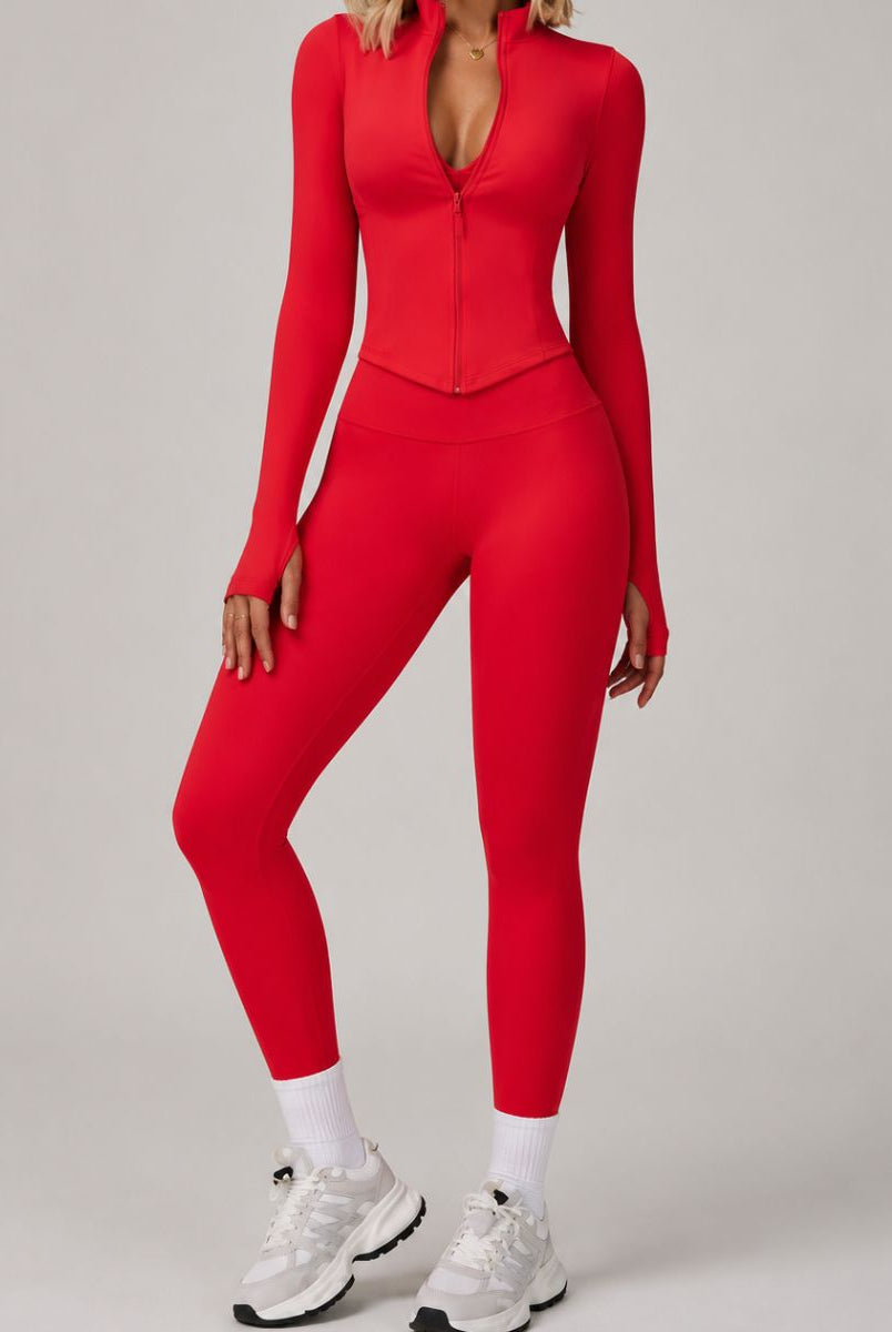 Model wearing the Red ContourFlex Three-Piece Set with top, jacket and leggings in a front-facing standing pose.
