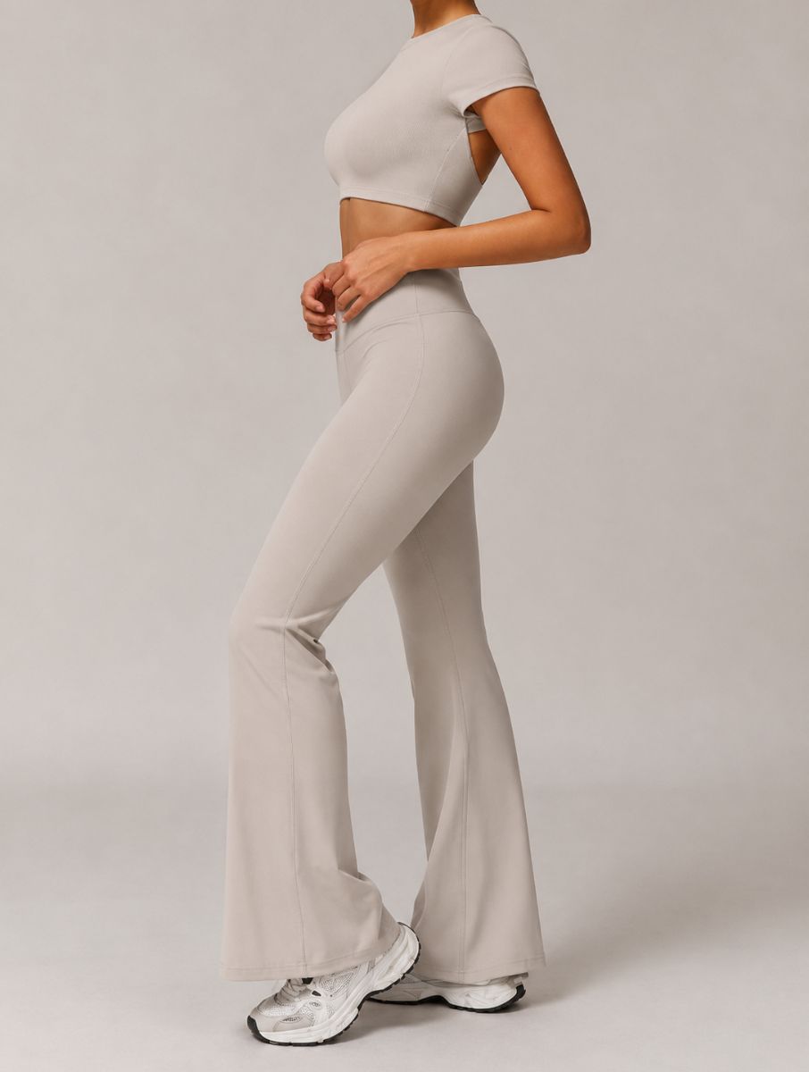 High-Waist Flared Yoga Leggings in grey apricot, shown in a side pose with a flared-leg design.