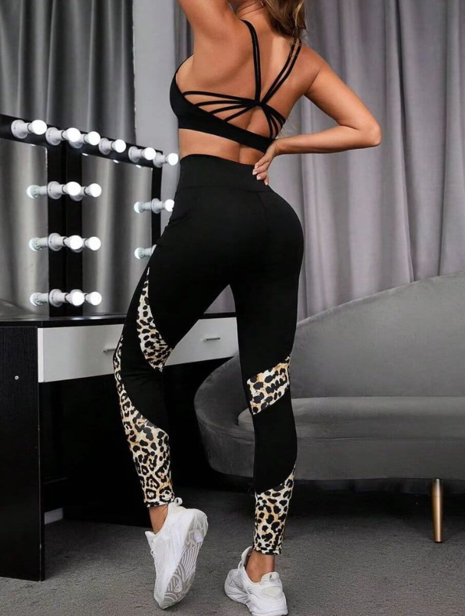 Savelle Leopard Contour Leggings in black with leopard pattern, shown in a side pose with contour panel detailing.