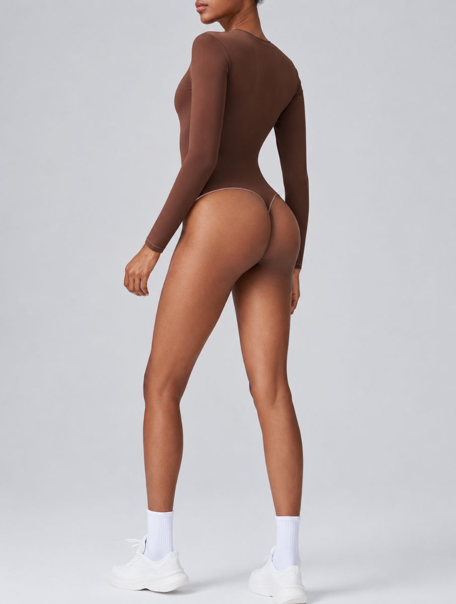 Woman wearing Aether Sculpting Long Sleeve Bodysuit in coffee, shown in a back pose with a sculpting fit.