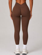 Woman wearing the ContourFlex Seamless Top & Leggings in Dark Coffee, standing in a back-facing pose with legs straight and arms relaxed at her sides.