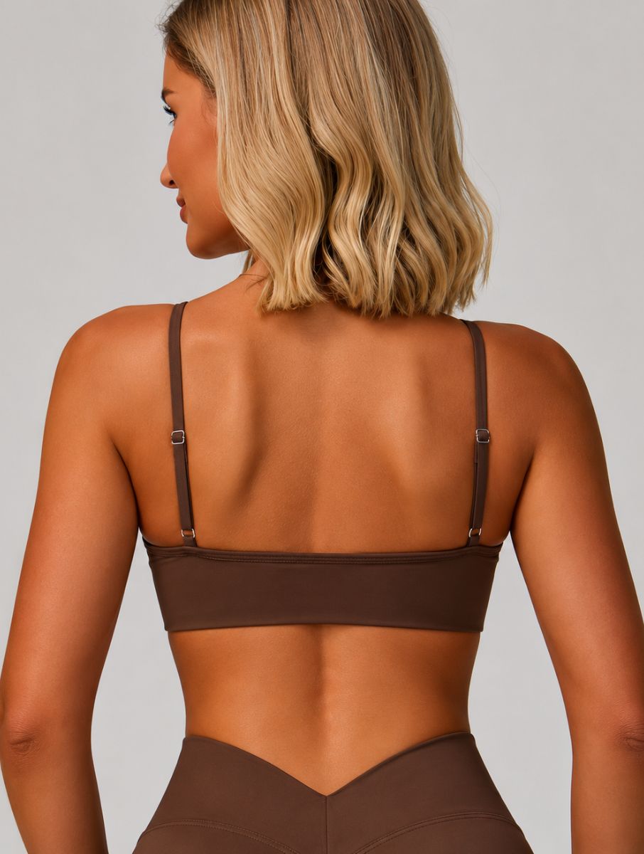 Woman wearing the ContourFlex Seamless Top & Leggings in Dark Coffee, shown from the back in a standing pose highlighting the top design.