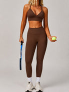 Woman wearing the ContourFlex Seamless Top & Leggings in Dark Coffee, standing in a front-facing tennis pose while holding a racket and ball.