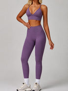 Woman wearing the ContourFlex Seamless Top & Leggings in Purple, standing in a three-quarter pose with one hand resting on her waist.