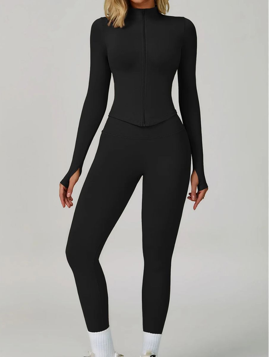 Model wearing the Black ContourFlex Three-Piece Set with top, jacket and leggings in a front-facing standing pose.