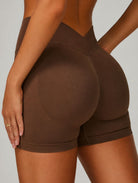 Back angled view of the ContourFlex Three-Piece Set shorts in dark coffee, highlighting the high-waisted design and contouring fit.