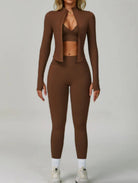 Model wearing the Dark Coffee ContourFlex Three-Piece Set with top, jacket and leggings in a front-facing pose with the jacket open.