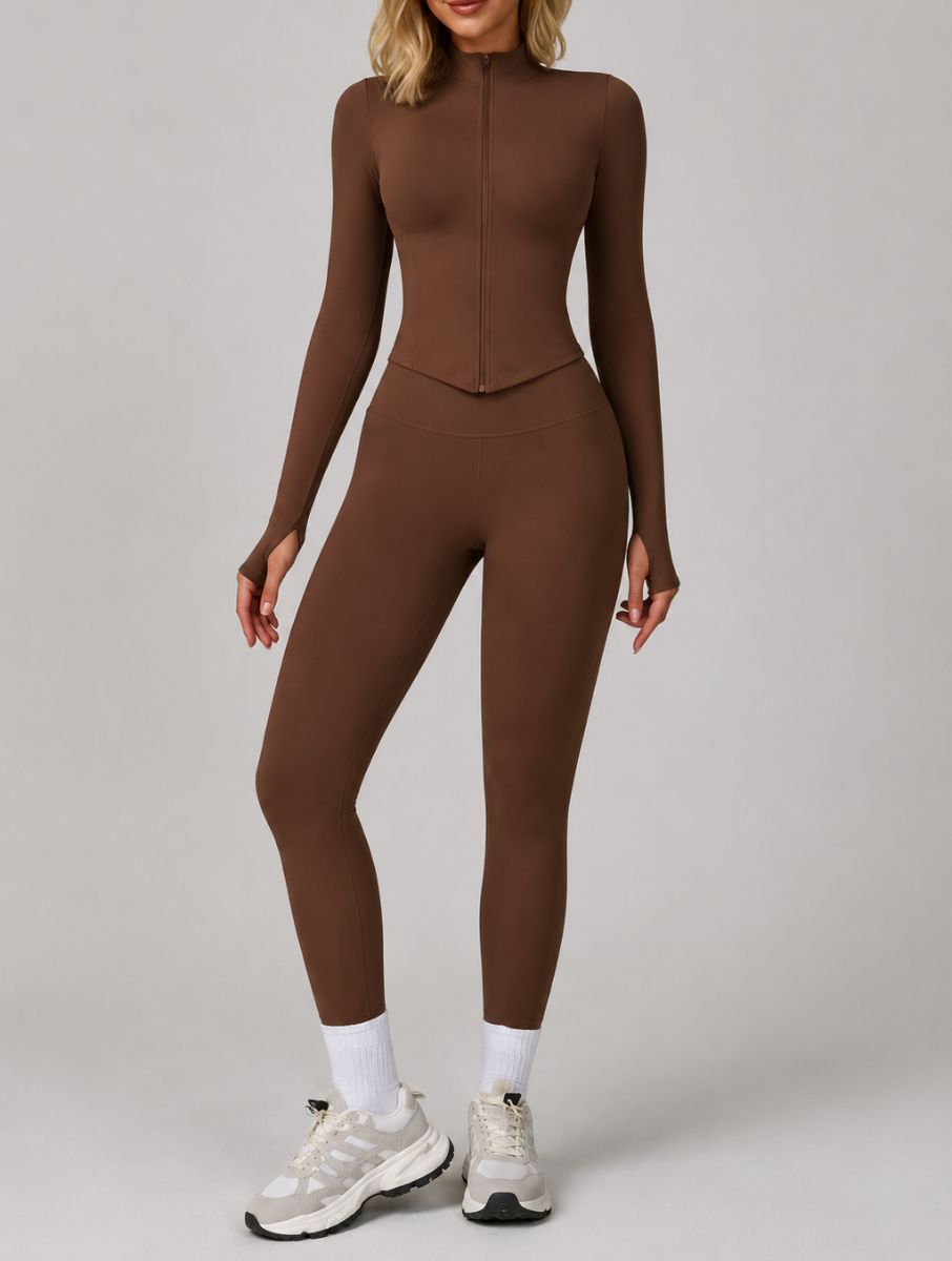 Model wearing the Dark Coffee ContourFlex Three-Piece Set with top, jacket and leggings in a front-facing standing pose.