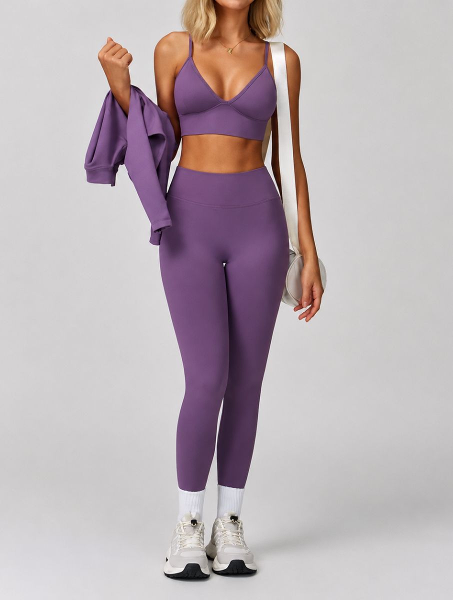 Model wearing the Purple ContourFlex Three-Piece Set in a walking pose, featuring the top and leggings.