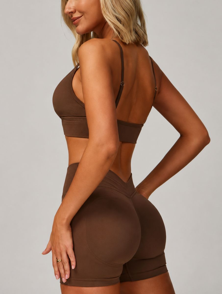 Woman wearing the ContourFlex Seamless Top & Shorts in Dark Coffee, posing in a back-angle stance showcasing the seamless fit.