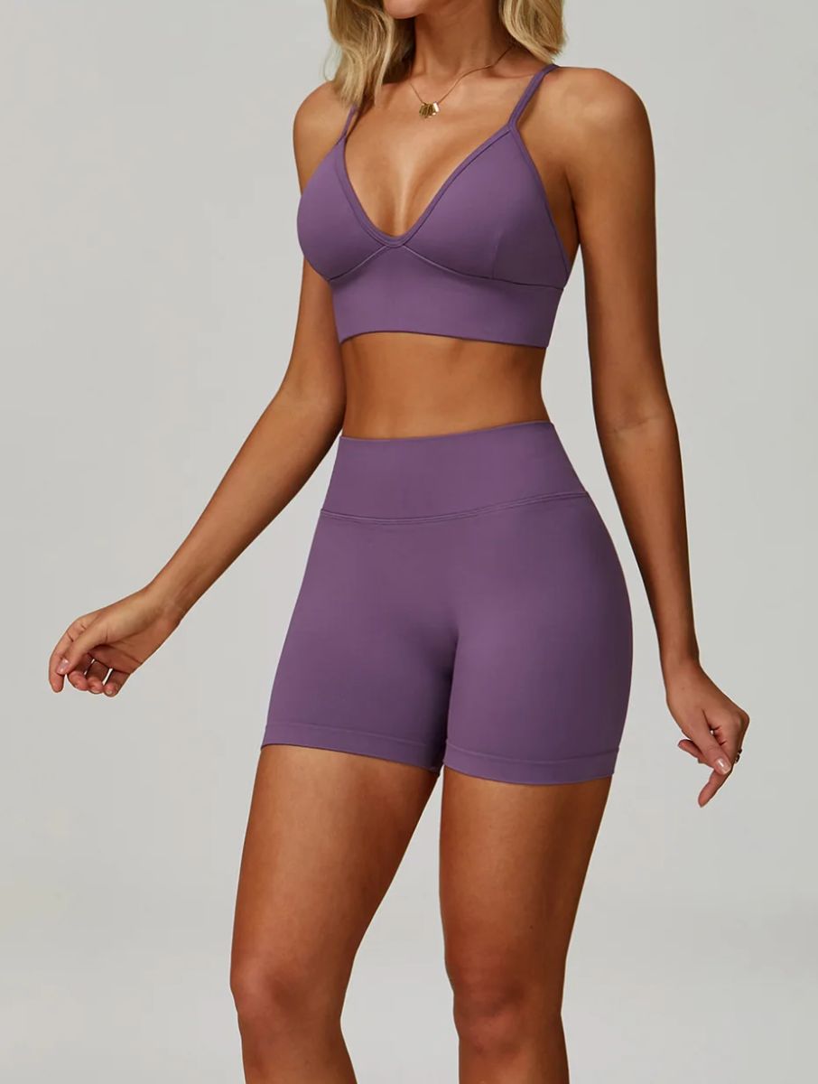 Woman wearing the ContourFlex Seamless Top & Shorts in Purple, posing in a front-angle stance with a relaxed posture.