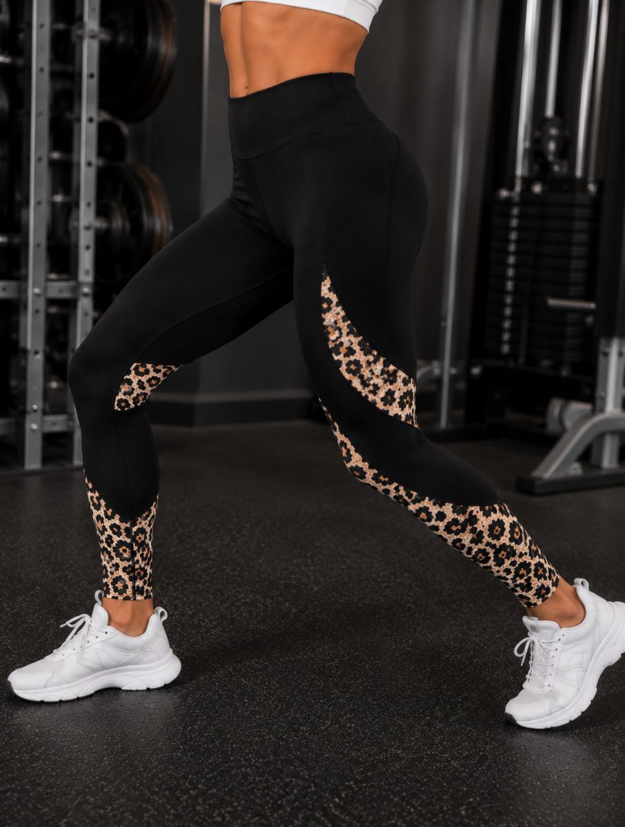 Savelle Leopard Contour Leggings in black with leopard pattern, shown in a lunge pose with contour panel detailing.