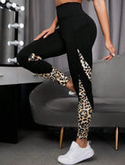 Savelle Leopard Contour Leggings in black with leopard pattern, shown in a side pose with contour panel detailing.