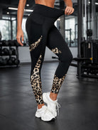 Savelle Leopard Contour Leggings in black with leopard pattern, shown in a side pose with contour panel detailing.