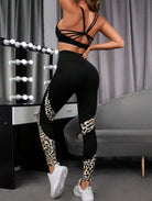 Savelle Leopard Contour Leggings in black with leopard pattern, shown in a side pose with contour panel detailing.