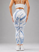 Seamless Tie-Dye Scrunch Leggings in blue, shown in a back pose with a tie-dye pattern.