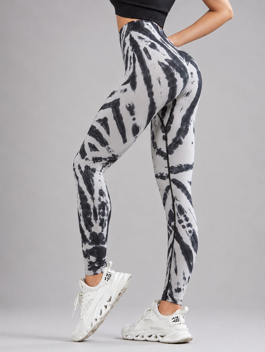 Seamless Tie-Dye Scrunch Leggings in grey, shown in a side pose with a tie-dye pattern.