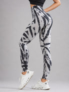 Seamless Tie-Dye Scrunch Leggings in grey, shown in a side pose with a tie-dye pattern.
