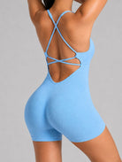 Veloura Seamless Sculpt Jumpsuit in sky blue, shown in a back pose with an open-back design.